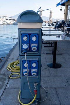 Napoli, Italy - September 27th 2026  Marina service pedestal with electric power sockets and water tap on pier