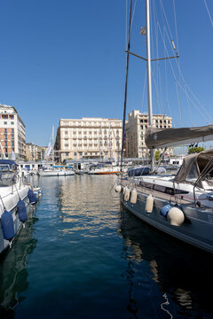 Napoli, Italy - September 27th 2026  Yachts and luxury sailing boats moored in Naples marina with Grand Hotel Santa Lucia background