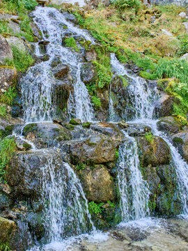 Cascada del Riu de la Molina, picturesque waterfall in Cam&iacute; de les Pardines. Encamp, Andorra, Europe