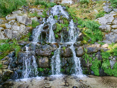 Cascada del Riu de la Molina, picturesque waterfall in Cam&iacute; de les Pardines. Encamp, Andorra, Europe