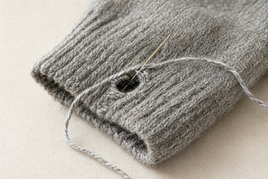 Mending a Hole in a Knitted Sweater Cuff