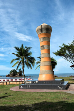 Pantai Kuala Kemasik Beach Park, Terengganu, Malaysia - seaside recreational area, tropical trees, public seating, tiled walkways, pavilion structures, and the coastal waterfront in the background.