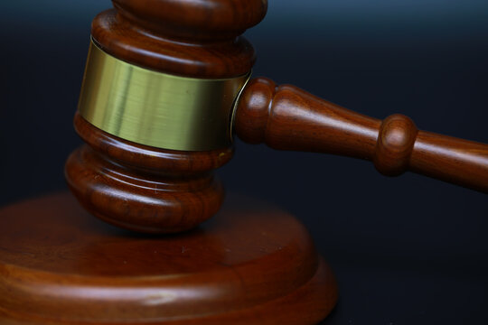 Close-Up of Wooden Gavel on Dark Background Symbolizing Justice and Law