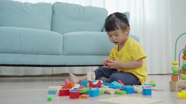 Happy Asia children play and learn toy blocks.family is happy and excited in the house. daughter having fun spending time, Activity, development, IQ, EQ, meditation, brain, muscles, essential skills.