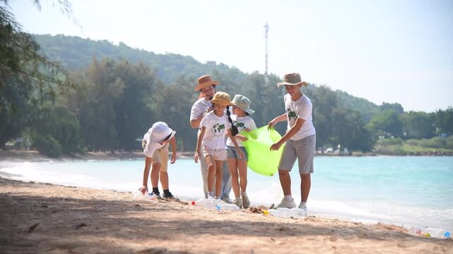 Group of teacher and school children on ecotourist trip  learning show beach take care of environment.