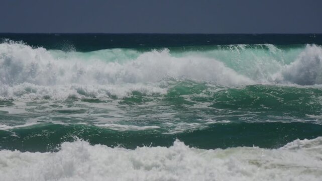Large ocean waves breaking in Huntington Beach