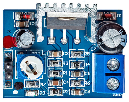 Audio amplifier circuit board with heatsink and blue terminal block electronic prototyping and hardware engineering component for sound signal processing and amplification