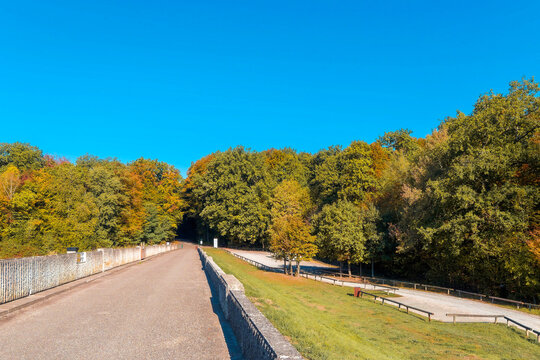 Main dike of Michelbach lake between the municipalities of Aspach-Michelbach and Aspach-Le-Bas in Haut-Rhin (France-Alsace) - Entrance gate and view of the visitor parking areas