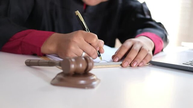 Lawyers or advocates signing consent documents, concepts of justice, corporations, justice and rights, insurance, courts and authorities. World Justice Day
