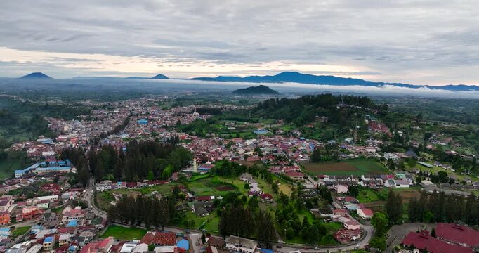 Aerial drone of valley with farmland and the town of Berastagi. Sumatra, Indonesia.