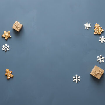 Festive winter scene with gifts gingerbread and snowflakes on a blue background