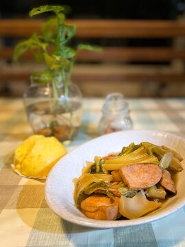 Chinese vegetarian stew with pickled mustard greens, tofu, and plant-based protein, served on a dining table during the Vegetarian Festival.
