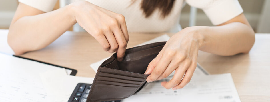 Debt financial concept, stressed problem asian woman hand open empty wallet, purse not have budget of money to pay no have credit card, not able payment bill, loan or expense with bank, bankruptcy.