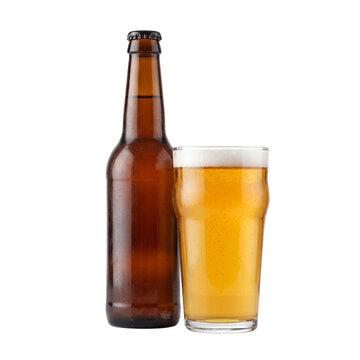 A brown glass beer bottle standing next to a full pint glass with golden lager and frothy foam transparent background