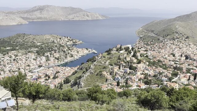 Panoramic view over the houses and bays of Symi island, Greece
