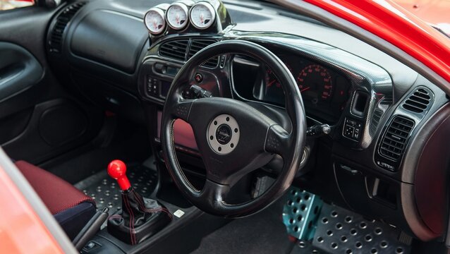 Mitsubishi Lancer Evolution cockpit with custom gauges and steering wheel