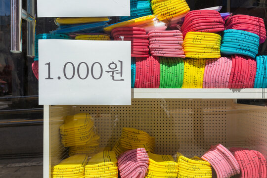 Stacks of Colorful Korean Exfoliating Scrub Towels with a Price Tag