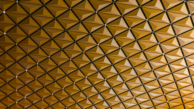 Diamond‑faceted geometric architectural ceiling
