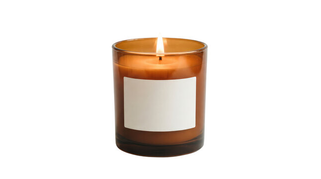 A single lit scented candle burning inside a transparent amber-colored glass jar featuring a blank rectangular white paper label on the front, isolated against a clean solid white background