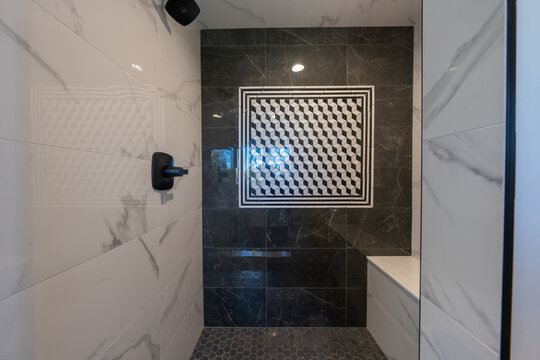 Bathroom shower has been updated with new ceramic tile and fixtures