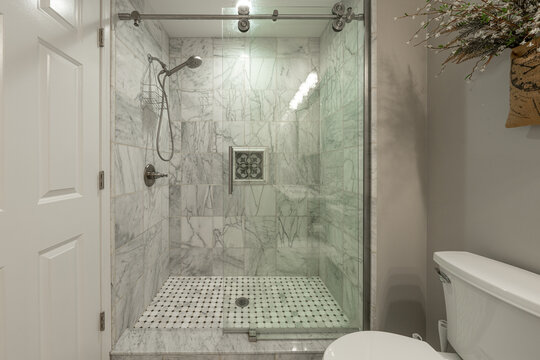 Bathroom shower has been updated with new ceramic tile and fixtures