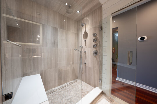 Bathroom shower has been updated with new ceramic tile and fixtures