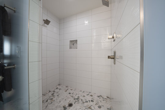 Bathroom shower has been updated with new ceramic tile and fixtures