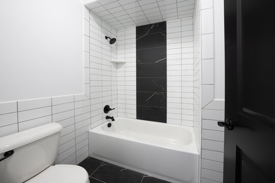 Bathroom shower has been updated with new ceramic tile and fixtures