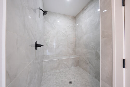 Bathroom shower has been updated with new ceramic tile and fixtures