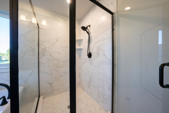 Bathroom shower has been updated with new ceramic tile and fixtures