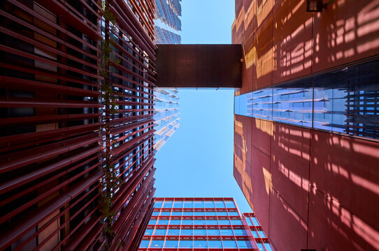 Modern Apartment Buildings From Ground Level With Clear Blue Sky