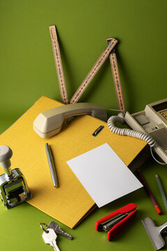 Detective desk with retro telephone, keys and folder