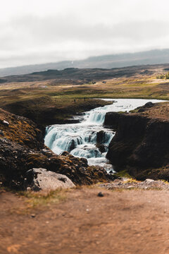 Waterfall Flowing Through Icelandic Highlands