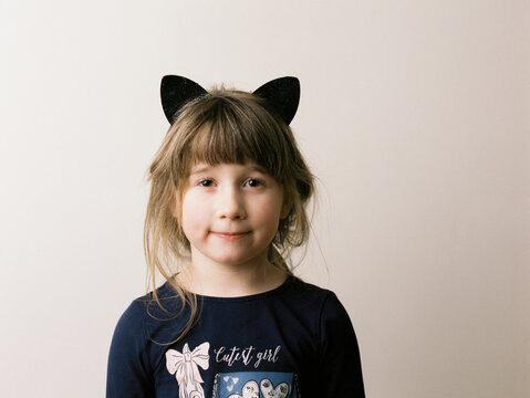 medium format 120 film studio portrait of smiling girl with cat ears