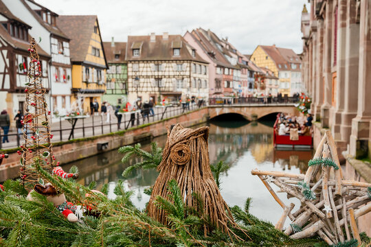 Urban Christmas decorations along the river in Colmar