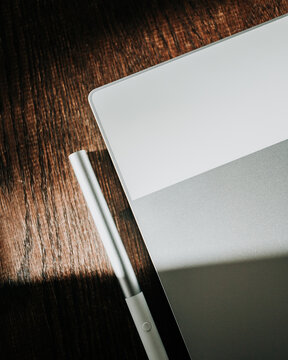 Tablet and Stylus on Wood