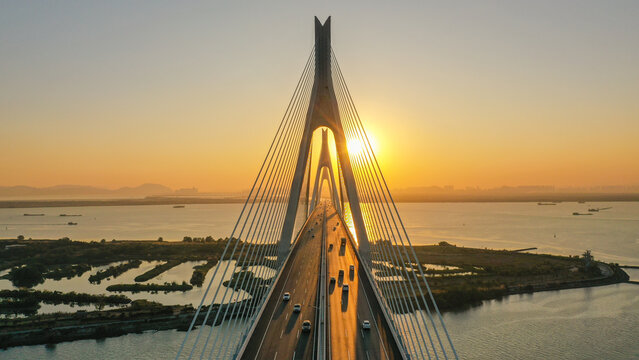 Aerial view of cable‑stayed bridge at sunset