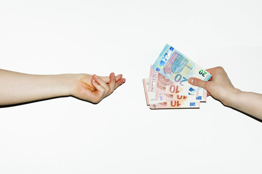 Person accepting money cash payment that other person offers