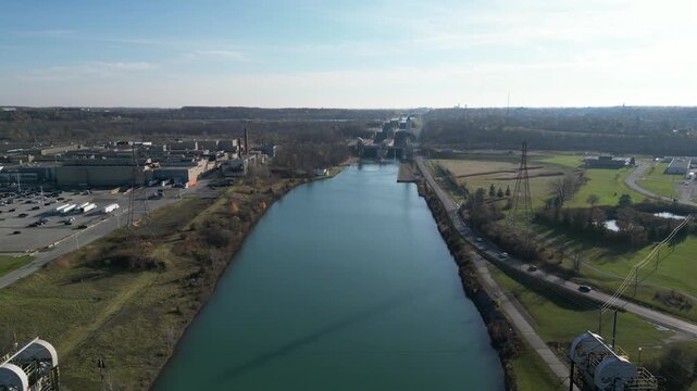 Aerial over the Welland Canal, part of the St. Lawrence Seaway and Great Lakes Waterway in St. Catharines, Ontario, Canada. Lock 5 in Thorold. Autumn in November 2024.