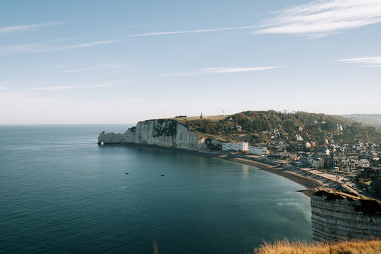 White chalk cliffs of Etretat overlooking the blue English Channel along the coast of France