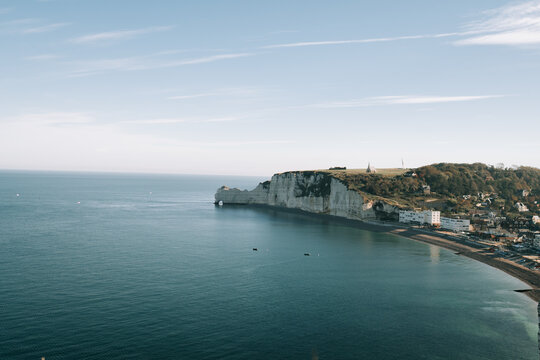 White chalk cliffs of Etretat overlooking the English Channel during a clear day in Normandy France