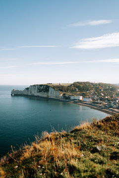 Chalk cliffs of Etretat overlooking the English Channel during a sunny morning in France