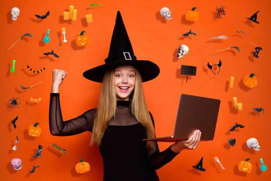 Photo of cute lucky lady wear black wizard costume cap riding fist sale shopping modern gadget isolated orange color background