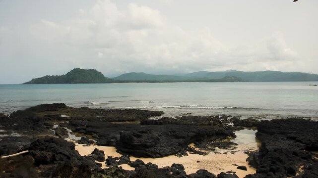 View of mainland S&atilde;o Tom&eacute; from a beach on Ilh&eacute;u das Rolas, the equator island, S&atilde;o Tom&eacute; and Pr&iacute;ncipe