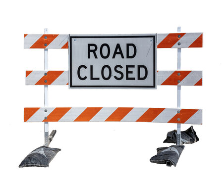 Isolated under construction road closed barrier sign with sandbags weights