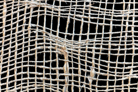 Crude loose string mesh isolated on a black background 