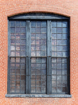 Industrial window set in an old brick wall background 
