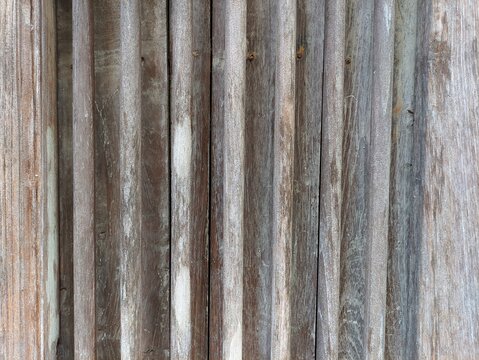 Weathered vertical wooden planks texture background rustic aged wood wall panels surface for design backdrop, architectural surface, and natural background.