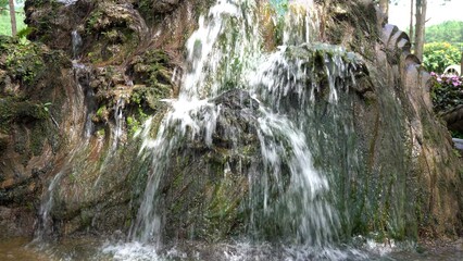 Garden cascade flowing over rocks in Da Lat Vietnam © IbragimovN