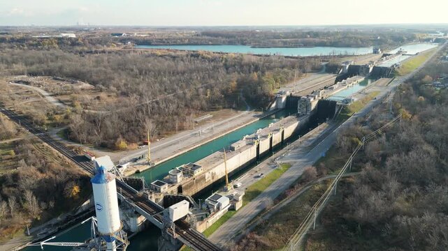 Aerial over locks 4, 5 and 6 of the Welland Canal, part of the St. Lawrence Seaway and Great Lakes Waterway in St. Catharines, Ontario, Canada. Thorold and Niagara Falls. Autumn in November 2024.